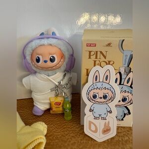 Pin For Love “Determination” with full fit & yellow hoodie and two charms.